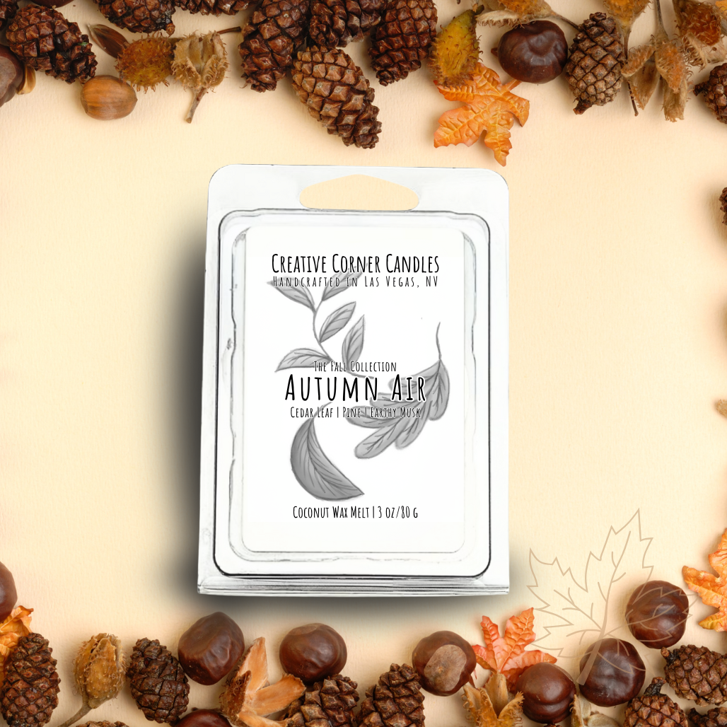 Autumn Air wax melts with cedar leaf, amber, and earthy musk scent in coconut soy blend, hand-drawn label illustration of autumn leaves.