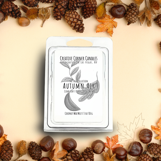 Autumn Air wax melts with cedar leaf, amber, and earthy musk scent in coconut soy blend, hand-drawn label illustration of autumn leaves.
