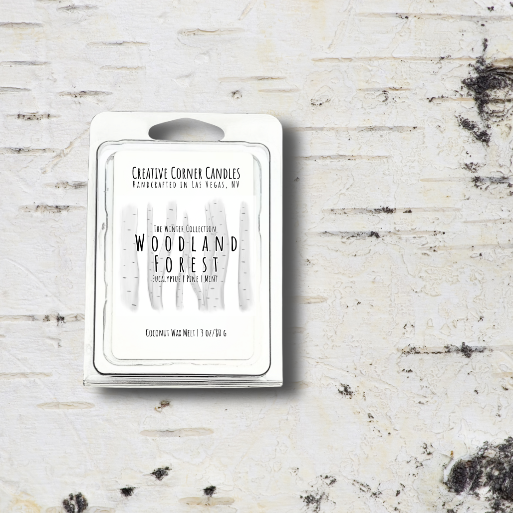 Wax melt packaging labeled 'Woodland Forest' by Creative Corner Candles on a textured white background.