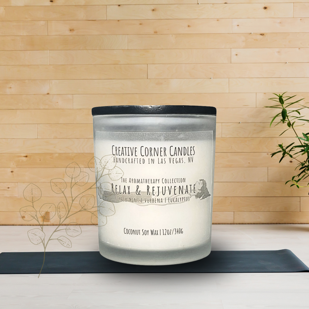 Relax and Rejuvenate handcrafted candles with a refreshing scent and a label illustrated with a hand-drawn depiction of a woman lying in a restful position