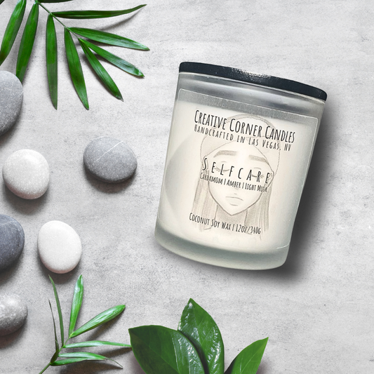 Selfcare handcrafted candles with a gentle, rejuvenating scent and a label featuring a hand-drawn illustration of a woman's face with closed eyes and a spa headband.