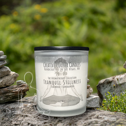 Tranquil Stillness handcrafted candles with a calming scent and a label adorned with a hand-drawn illustration of a woman doing a cross-legged yoga pose