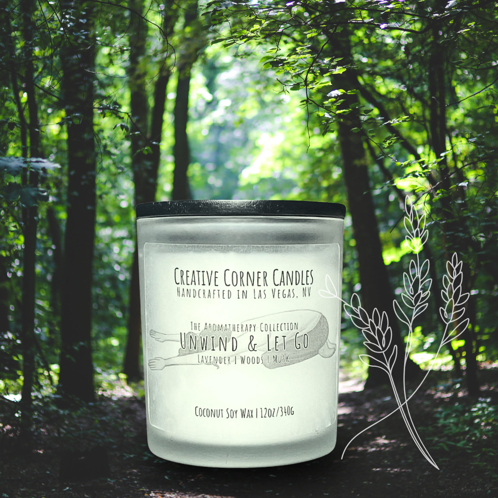 Unwind and Let Go handcrafted candles with a soothing aroma and a label featuring a hand-drawn illustration of a woman doing a child yoga pose