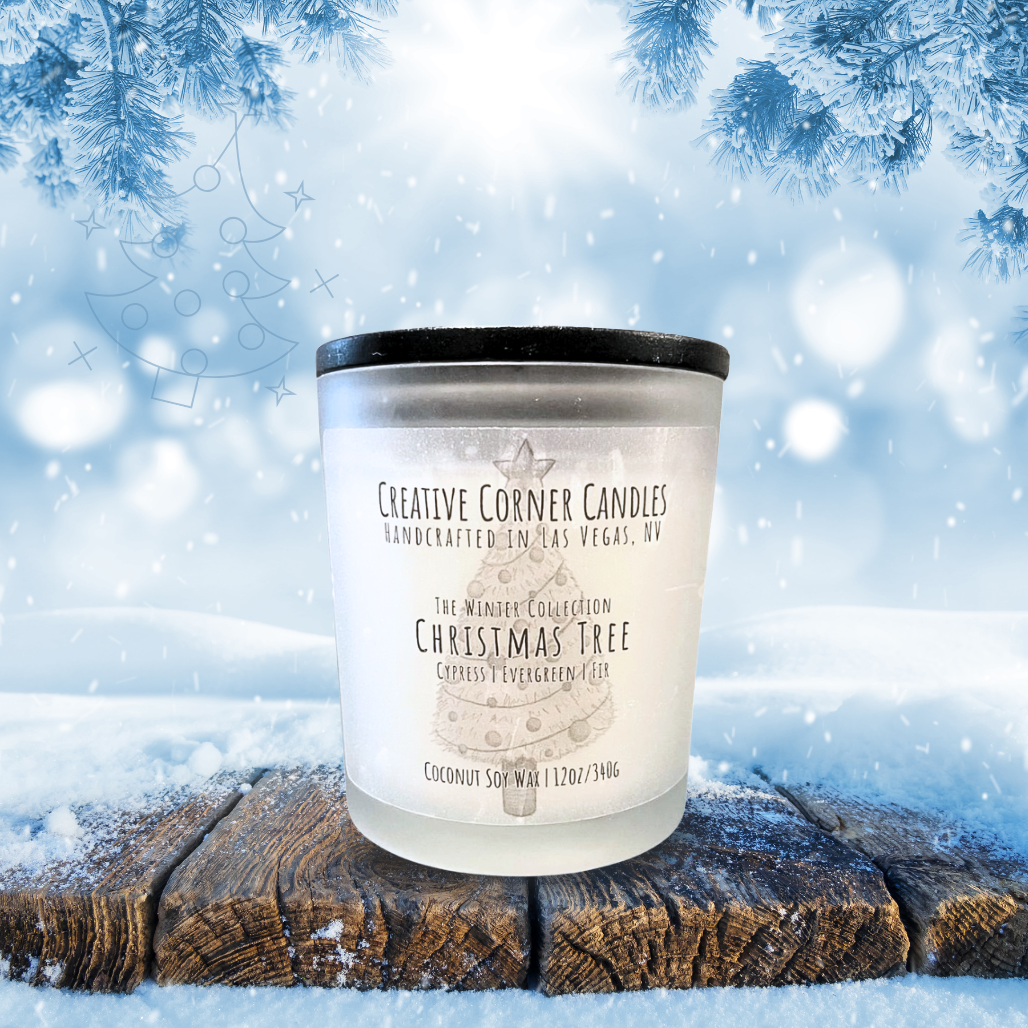 Candle with a label on a snowy background