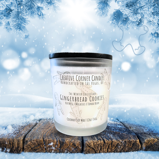 Candle labeled 'Gingerbread Cookies' by Creative Corner Candles on a snowy background
