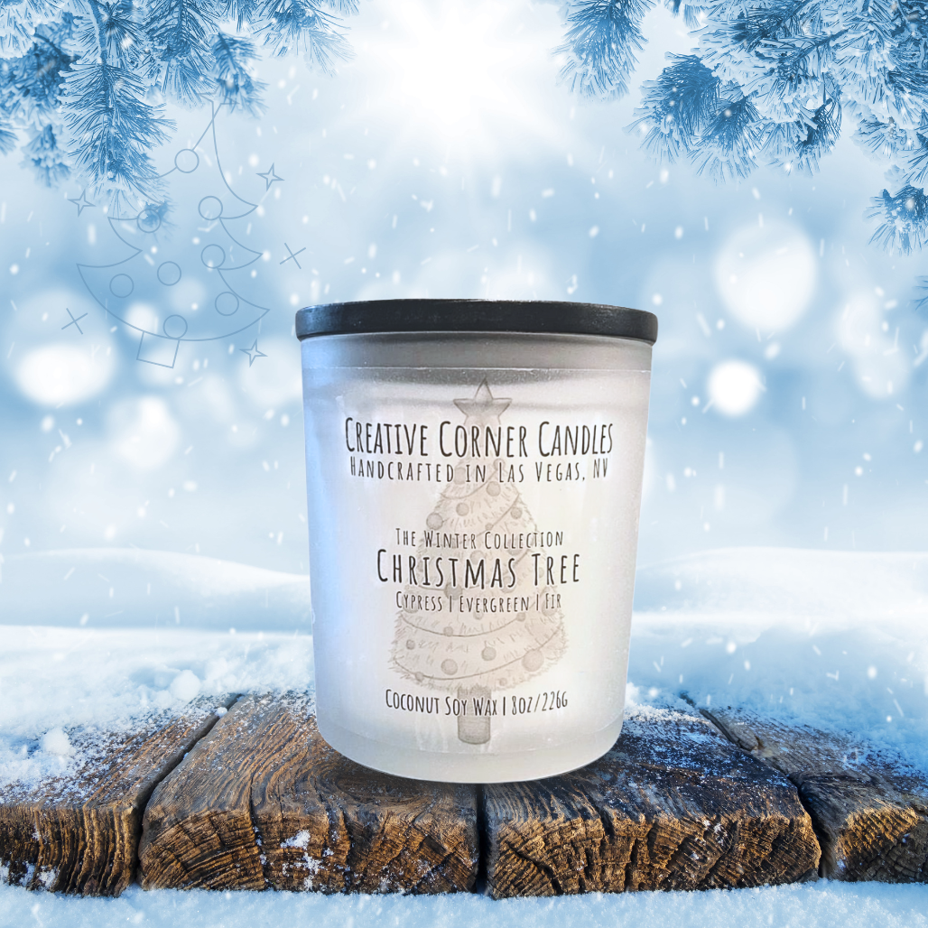 Candle with a label on a snowy background