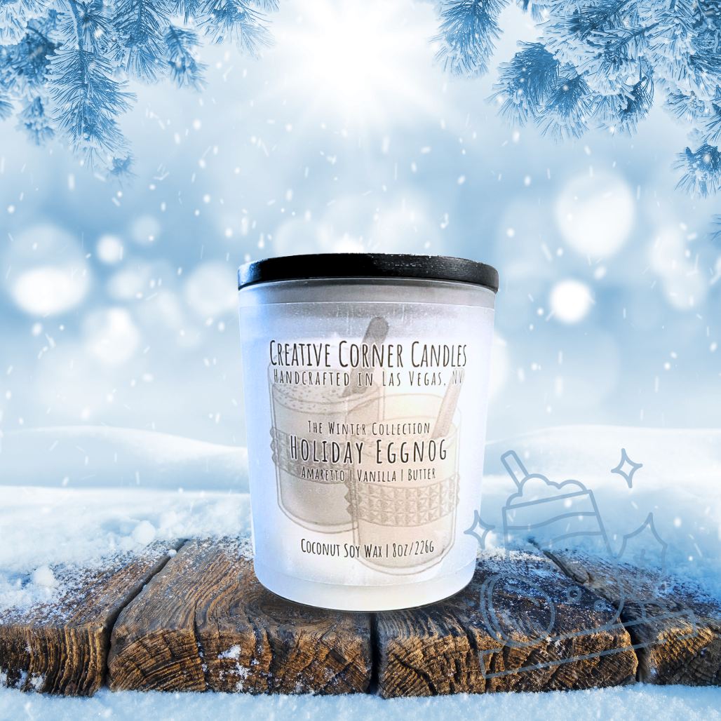 Candle labeled 'Holiday Eggnog' by Creative Corner Candles on a snowy background with Christmas decorations.