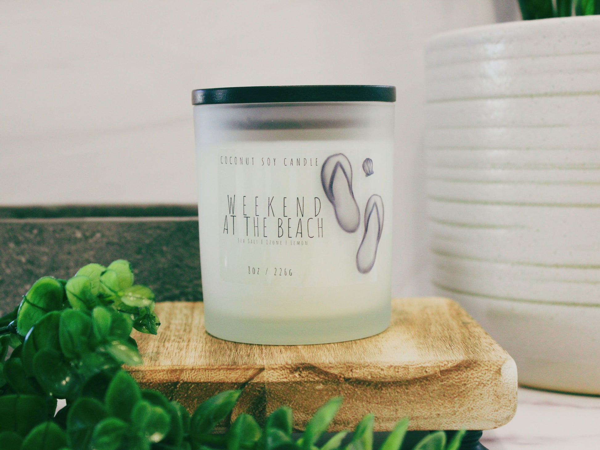 Transport your senses to the coast with 'Weekend at the Beach,' a Coconut Soy Candle. Housed in an elegant glass jar, this hand-poured candle emits a warm, beachy glow. The label features a beach-inspired design, capturing the essence of a relaxing seaside getaway. Enjoy the harmonious blend of coconut and soy wax for a clean, enduring burn. Elevate your space with the refreshing scents of 'Weekend at the Beach' candle. Ideal for creating a coastal ambiance at home. Shop now for a beach retreat experience.