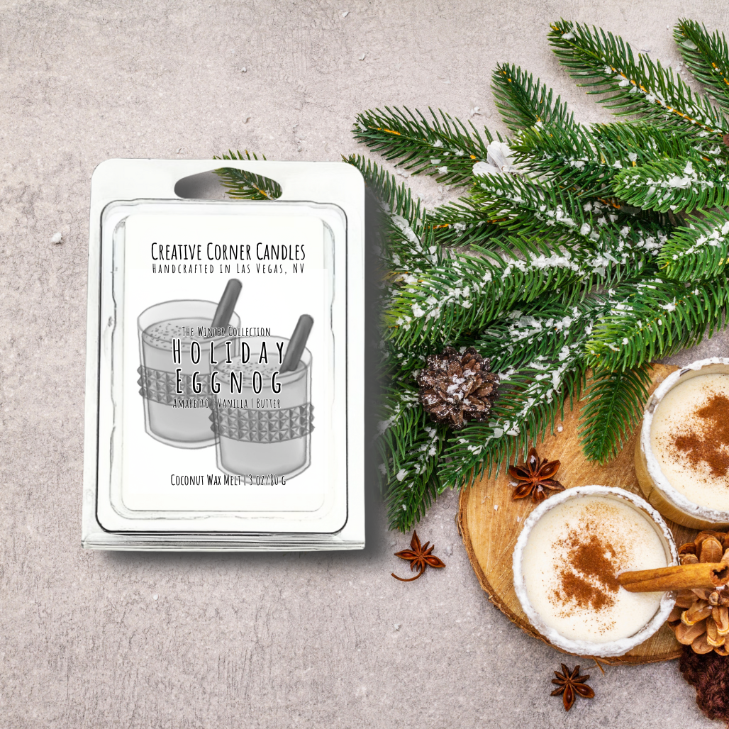 Holiday Eggnog candle packaging with a festive arrangement on a gray surface