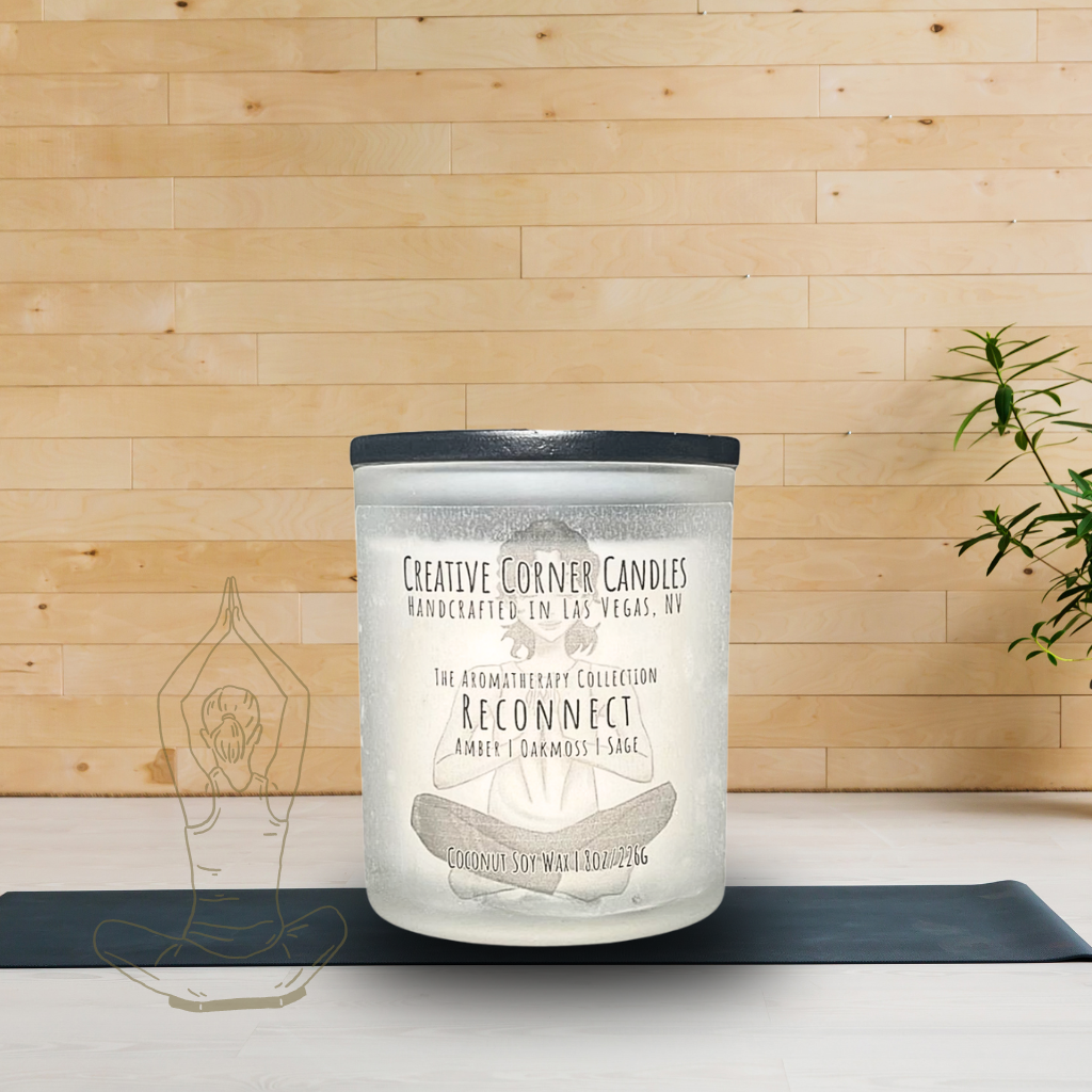 Reconnect handcrafted candles with an energizing scent and a label featuring a hand-drawn illustration of a woman doing the Sukhasana yoga pose