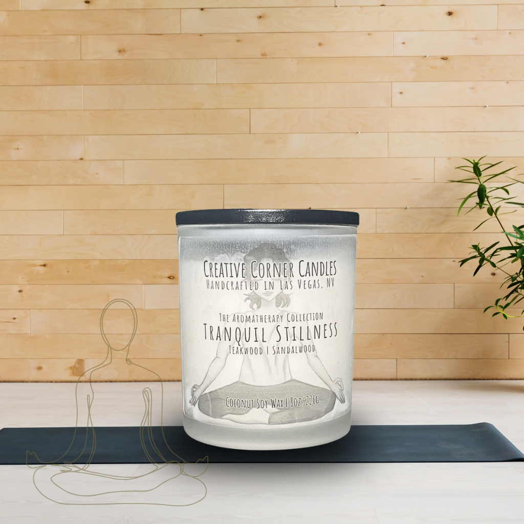 Tranquil Stillness handcrafted candles with a calming scent and a label adorned with a hand-drawn illustration of a woman doing a cross-legged yoga pose